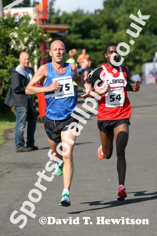 Ian Hudspith (Morpeth) and Tadele Geremew (Elswick)  during the Tyne Bridge Harriers Exhibition Park 5k, Newcastle.